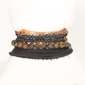 Stacked bohemian bracelets with beads and leather.