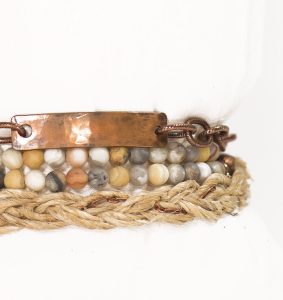 Rustic bracelet with beads and braided rope.