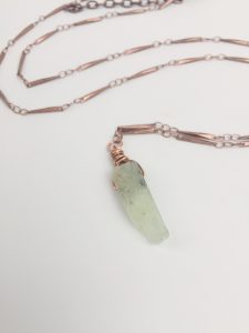 Copper chain necklace with raw crystal pendant.