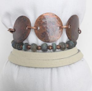 Copper necklace with stones on mannequin bust
