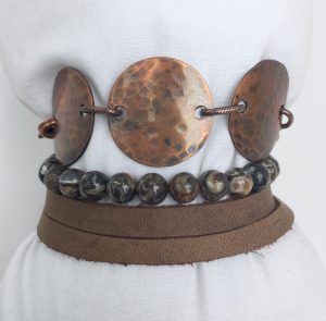 Handmade copper and bead bracelet on mannequin