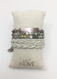 Handmade bead and leather bracelet on cushion