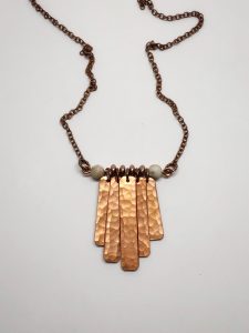 Hammered copper pendant necklace with chain.