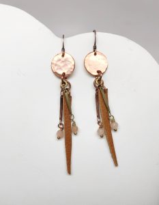 Handmade copper and leather dangle earrings.