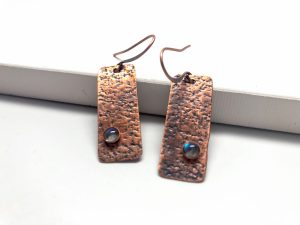 Textured copper earrings with stone accents