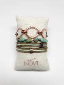 Boho turquoise bracelet on fabric pillow