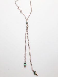 Elegant lariat necklace with abalone shell accents.