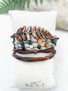 Handmade bracelet with ferns and beads.