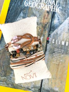 Handmade bracelets on pillow and National Geographic magazine