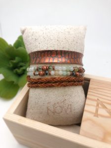 Handcrafted bracelets on display pillow
