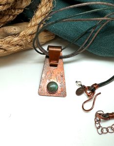 Handmade copper necklace with turquoise stone pendant.